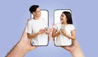 A young couple interacts joyfully while using smartphones. They share smiles and laughter, highlighting their connection through technology. photo