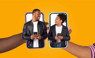 African American married couple shares a joyful moment while chatting on their smartphones. They engage with each other using a fun application, showing love and affection in their daily lifestyle. photo
