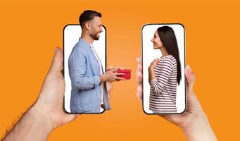 A couple is engaged in a joyful exchange using their smartphones. The man holds a gift while looking at the woman, who is smiling and appreciating the moment. photo