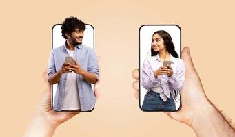 A couple holds smartphones, engaged in a joyful conversation. They smile at each other, showcasing love and affection despite the distance, highlighting modern communication through technology. photo