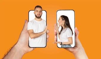 A couple interacts through their smartphones, showcasing the modern way of staying connected. Their expressions reflect the love and affection they share, even while apart. photo