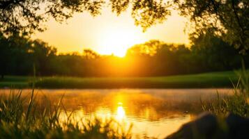 A beautiful sunset over a lake with trees in the background photo