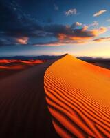 A desert scene with a sand dune and a cloudy sky photo