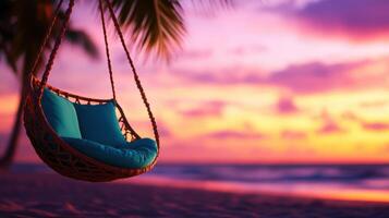 A blue beach chair is hanging from a rope on a beach photo