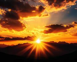 The sun is setting over a mountain range, casting a warm glow over the landscape photo