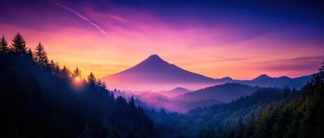 A mountain range with a purple sky in the background photo