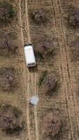 Drone image of moving vehicle in the garden video