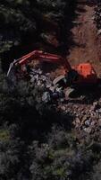 excavation machine doing road work in the forest video