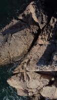 drone image moving by rising above the island video
