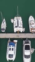 drone image of yachts moored at the pier video