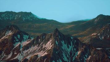 A painting of a mountain range with a blue sky in the background video