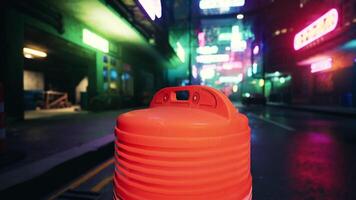 A red plastic container sitting on the side of a road video
