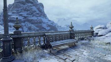 Serene winter landscape featuring a bench overlooking a snowy mountain view video