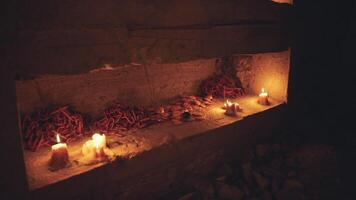 Candles and Offerings in a Dimly Lit Altar Setting During Evening Ritual video