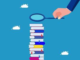 a hand holding a magnifying glass over a stack of books vector