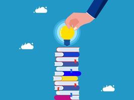 a hand is holding a book with a light bulb on top vector