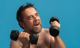 Elderly man exercises with dumbbells in bright setting for strength and fitness photo