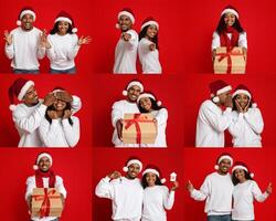A cheerful couple wearing Santa hats expresses holiday spirit while posing with wrapped gifts. The vibrant red backdrop enhances their joyful faces and playful gestures, creating a festive atmosphere. photo