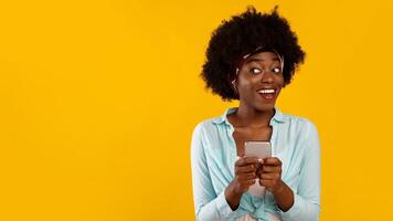 Happy African American Woman Using Mobile Phone Texting And Browsing Internet, Networking In Social Media App Standing Over Pink Background. Communication, Mobile Application For Smartphone. Panorama photo