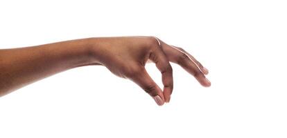 Black female hand picking up invisible small items isolated on white background. Panorama with copy space photo