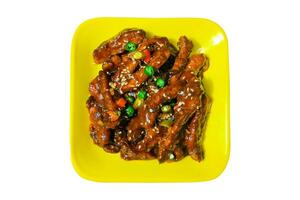 Spicy Korean chicken dish. Deep fried chicken with chili, and sour sauce in Korean style. sweet and spicy taste. Asian food concept. Selective Focus. Isolated photo