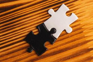 puzzle pieces, black and white, concept of unity between opposites photo
