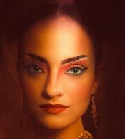Close up stylized portrait of a Japanese geisha with bright make up standing at the window photo