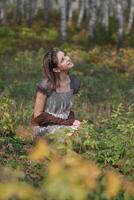 a woman in a forest photo