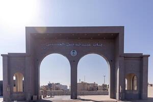 Taif, Saudi Arabia, 2024 - The Gate of Abdullah bin Abbas in Taif, Mecca province, with city buildings and blue sky background. One of the places often visited by Umrah pilgrims. photo