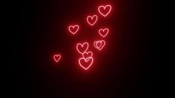 A set of red neon heart explosion effects on a black background. Symbols of love are scattered in the air video