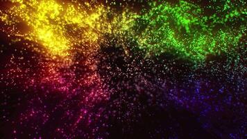Multi-colored particles swirl and sparkle like magical stars, falling from the sky. video