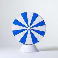 A blue and white spinning wheel on a white surface photo