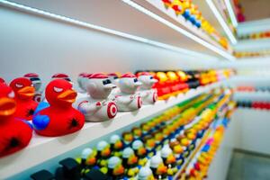 Colorful Rubber Ducks on Display in a Retail Store for Toy Enthusiasts and Collectors of All Ages photo