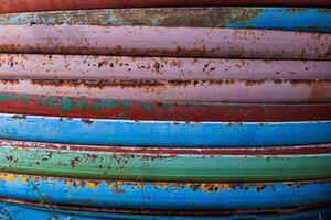 Close-up of a rusty iron fence. Metal rust. Metal corrosion. Rust and corrosion on old iron. photo