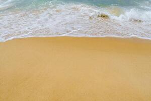 A person on a surfboard on a beach photo