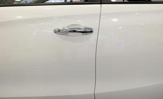 Handle of a silver car door photo