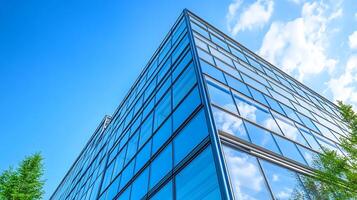 Modern corporate architecture with gleaming windows and a natural background photo