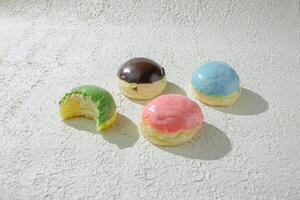 four different colored mini donuts photo