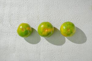 three orange on a wall photo