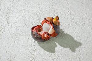 OpenedRipe mangosteen fruit isolated on a white background photo