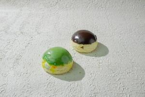 two pastries on a white surface photo