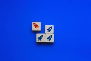 Leadership concepts and differences ,The red rocket goes to the opposite end of the group photo
