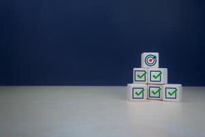 Target icon with correct checklist. Quality control assessment, business process and workflow development photo