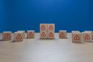 error occurred. Notification. Exclamation mark on wooden block photo