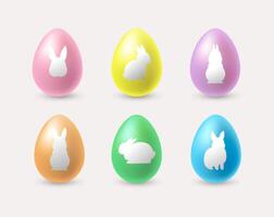 Set of realistic colorful Easter eggs with rabbit silhouettes vector