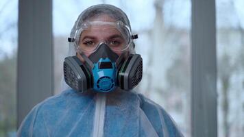 Concept of coronavirus quarantine, global covid-19 epidemic. Treatment of infection. Medic in hazrat protective suit show hands gesture for stop corona virus outbreak video