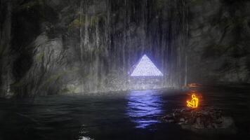 Person meditates on cave lake island with waterfall in front of glowing pyramid. 3D render, seamless loop. video