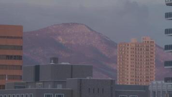 Full shot of city in the morning with mountains at the background video
