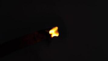 Burning candle s flickering flame progresses from brightness to darkness in a dramatic sequence. video