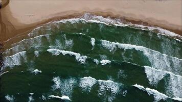 Top view of stormy sea wave close up texture. Powerful stormy sea ocean waves top-down view drone shot. video
